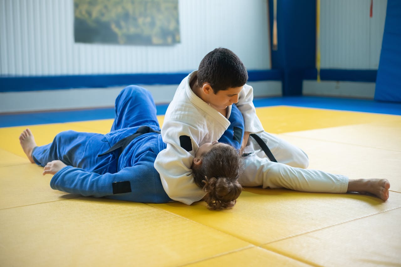 Athletes grappling on a tatami mat