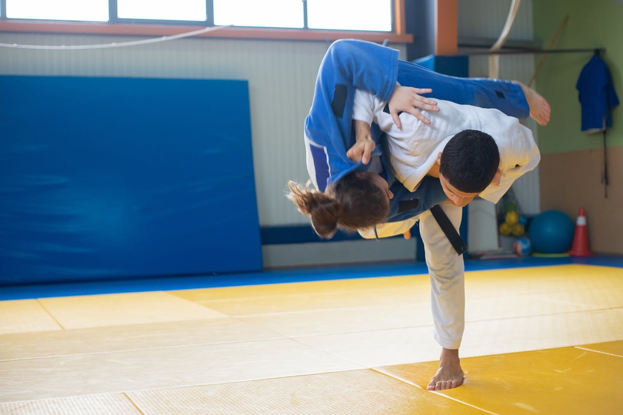 A judoka throwing an opponent to the ground